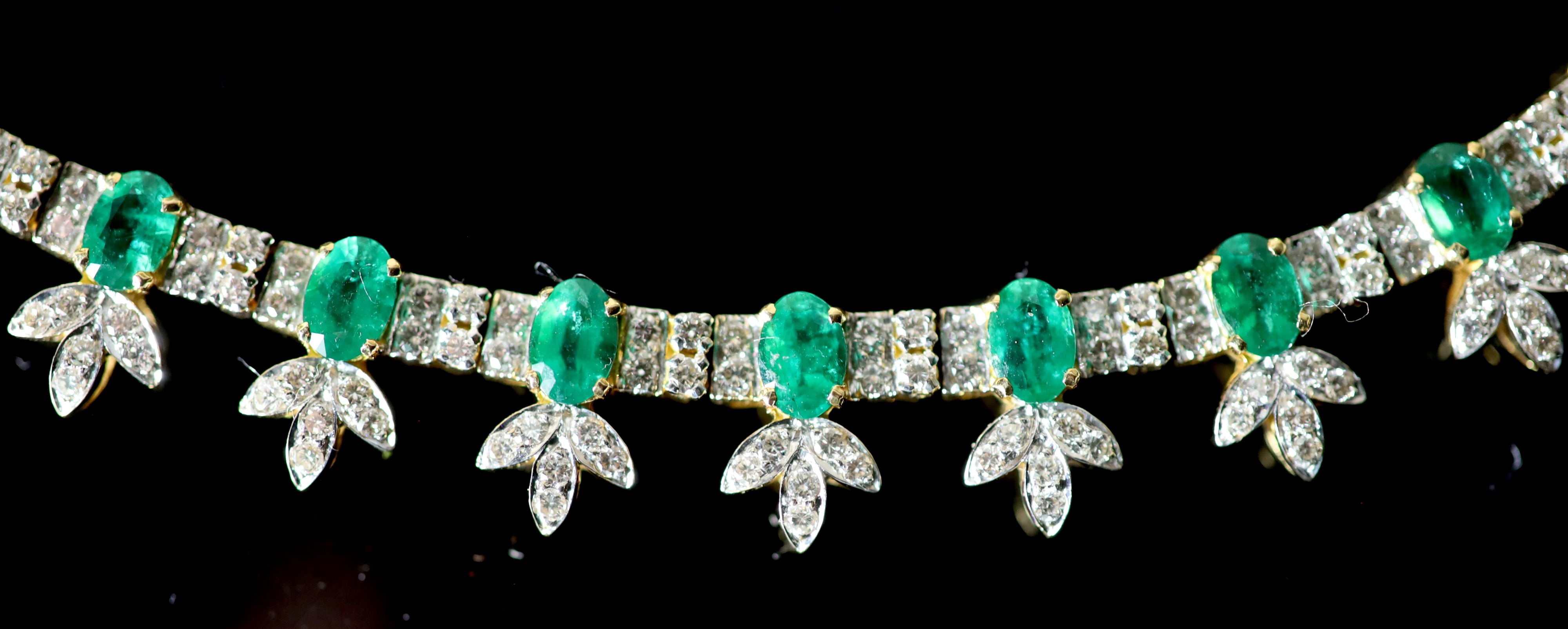 An attractive modern 18k gold, emerald and diamond cluster set choker necklace,